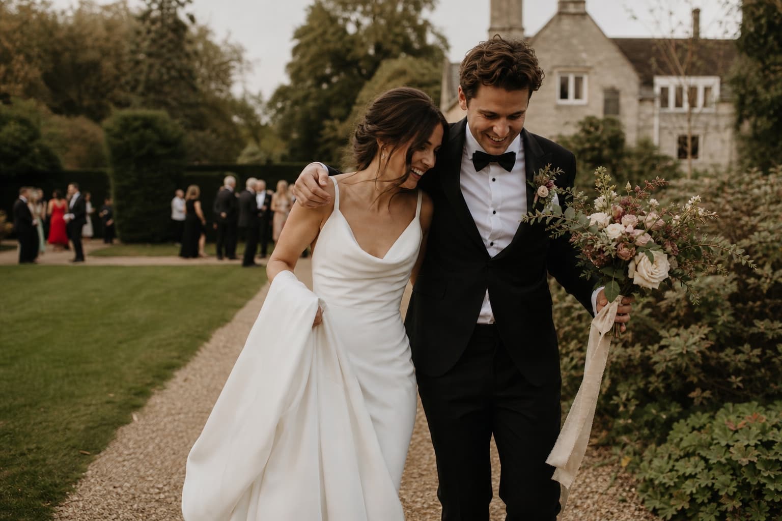 Newly married couple walking together after their ceremony